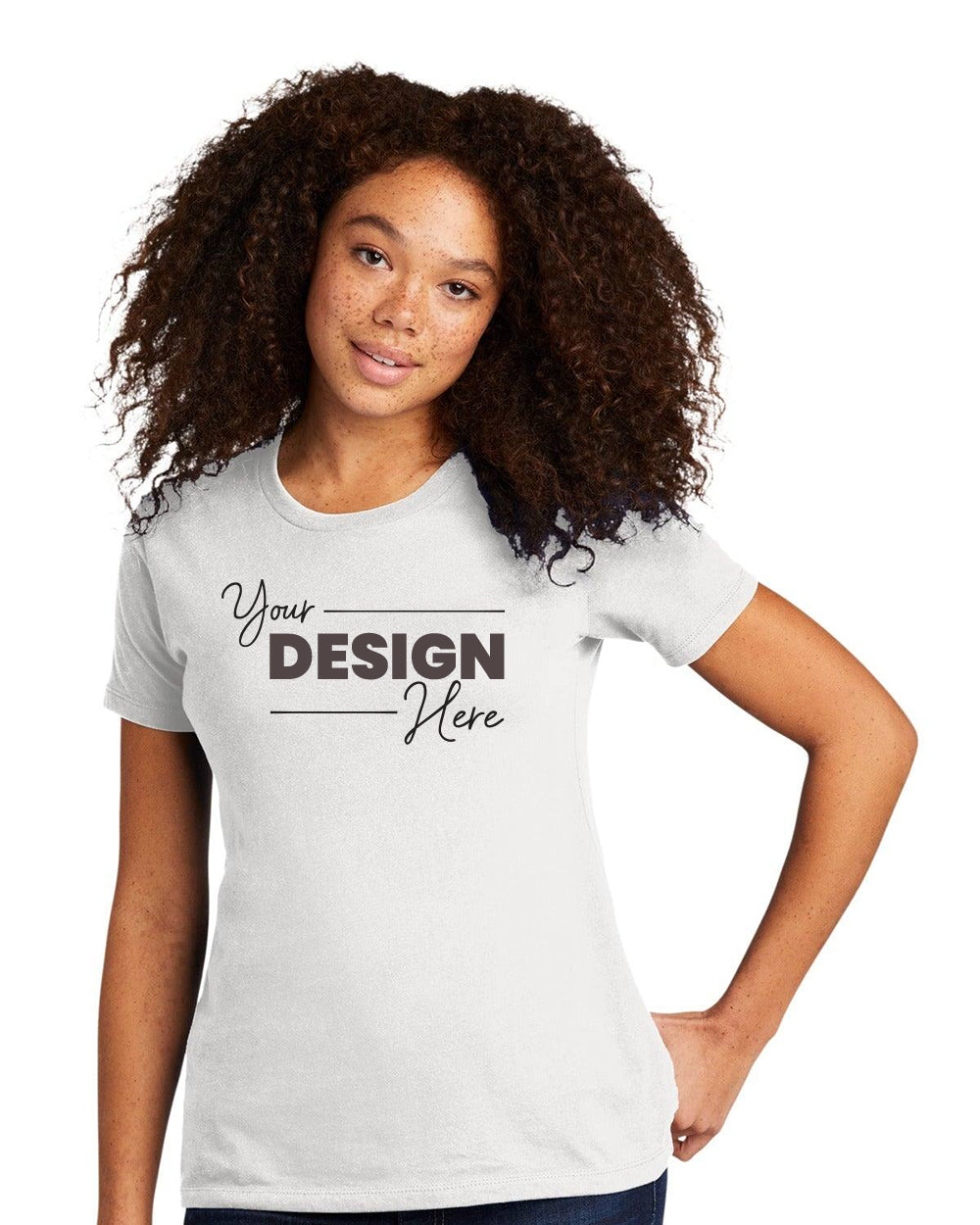 A woman with curly hair wears a Next Level Apparel Women's Cotton T-Shirt NL3900 in white, emblazoned with "Your Design Here," highlighting the customization possibilities in women's clothing.