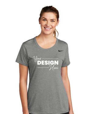 Woman wearing a gray Nike Ladies Legend T-Shirt CU7599 with Dri-FIT technology and a customizable design area.