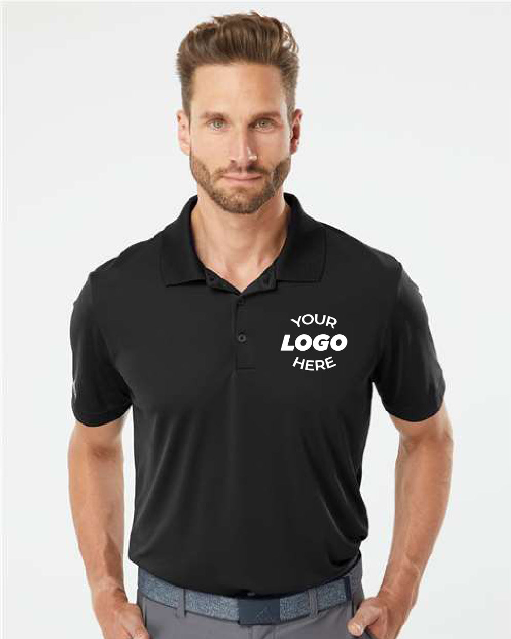 A bearded man wears a custom embroidered Adidas Lightweight Performance Polo, made from 100% recycled polyester, in black with "YOUR LOGO HERE" displayed on the left chest.