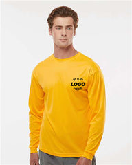 A person wears a vibrant yellow C2 Sport Performance Long Sleeve T-Shirt, branded with 