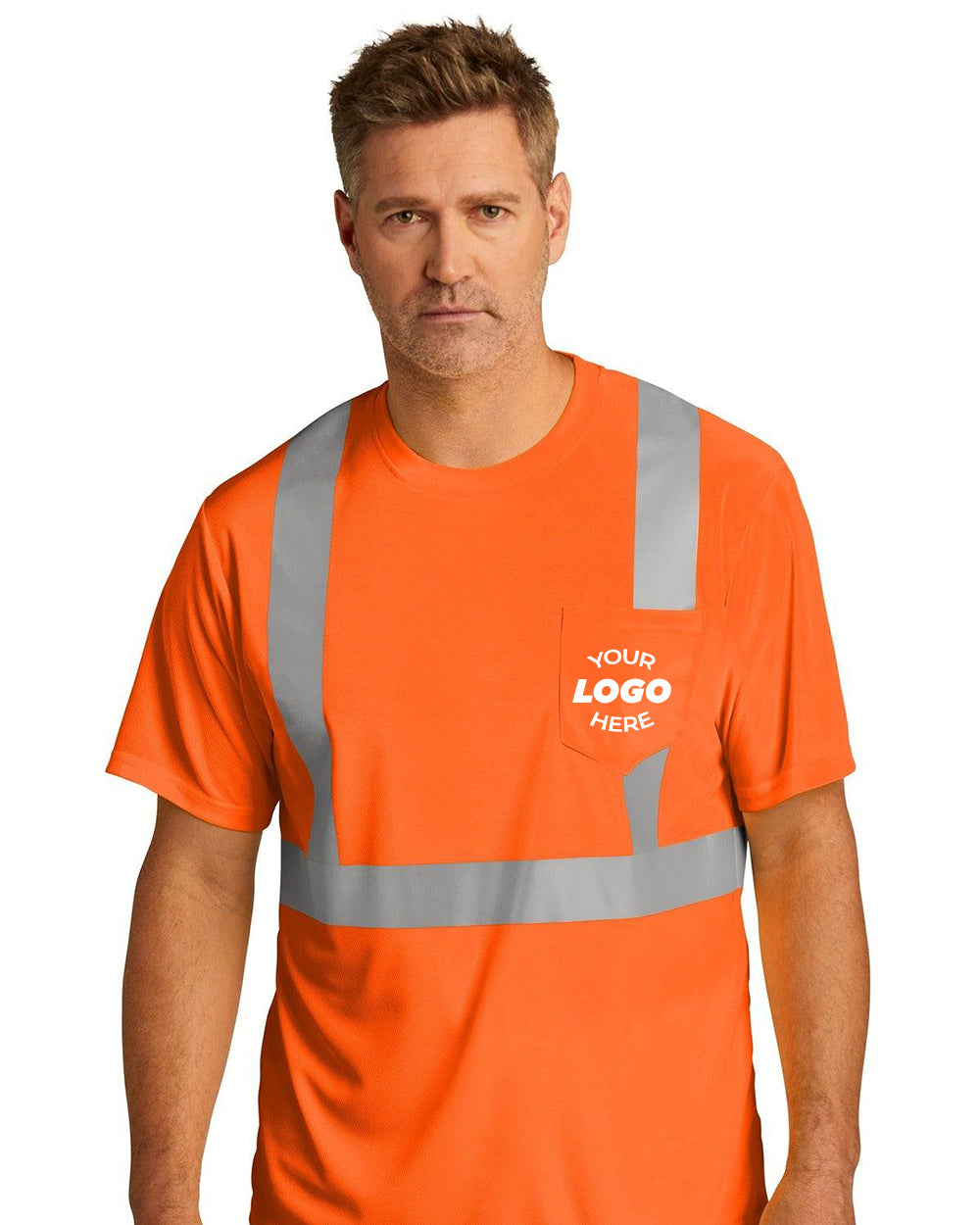 A man stands facing forward against a white background wearing a CornerStone ANSI 107 Class 2 Mesh T-Shirt (CS200) made of polyester birdseye mesh, featuring reflective stripes and a pocket labeled "Your Logo Here.