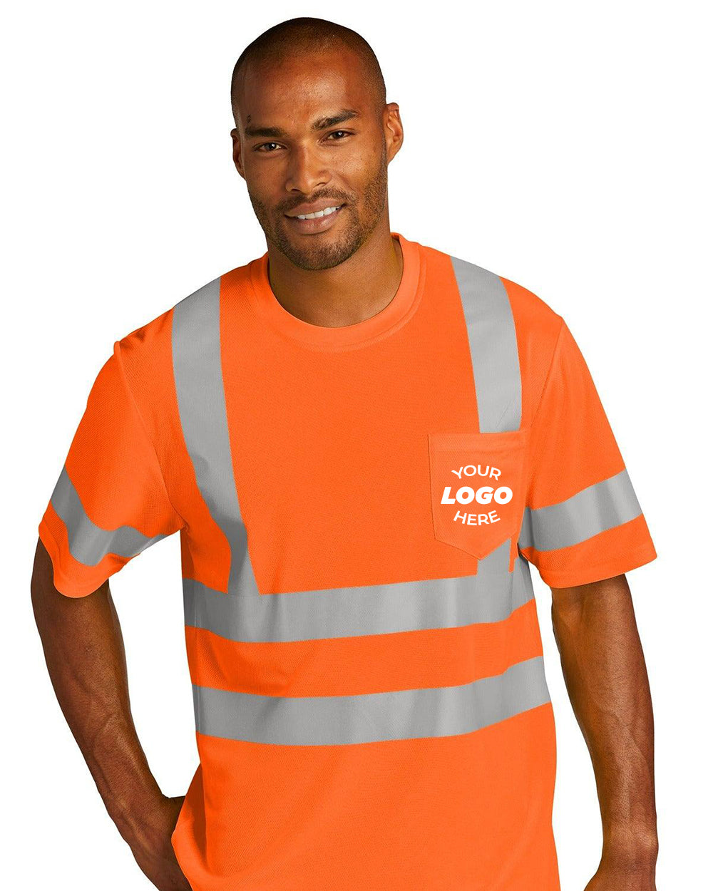 A man wearing a CornerStone ANSI 107 Class 3 Mesh T-Shirt CS202 in orange, featuring reflective stripes, a pocket, and "Your Logo Here" label.