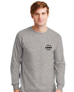 A man wears a Gildan (Pack of 36) 100% US Cotton Long Sleeve T-Shirt 2400, with a custom screen printed logo on the left chest—ideal for bulk orders of personalized shirts.