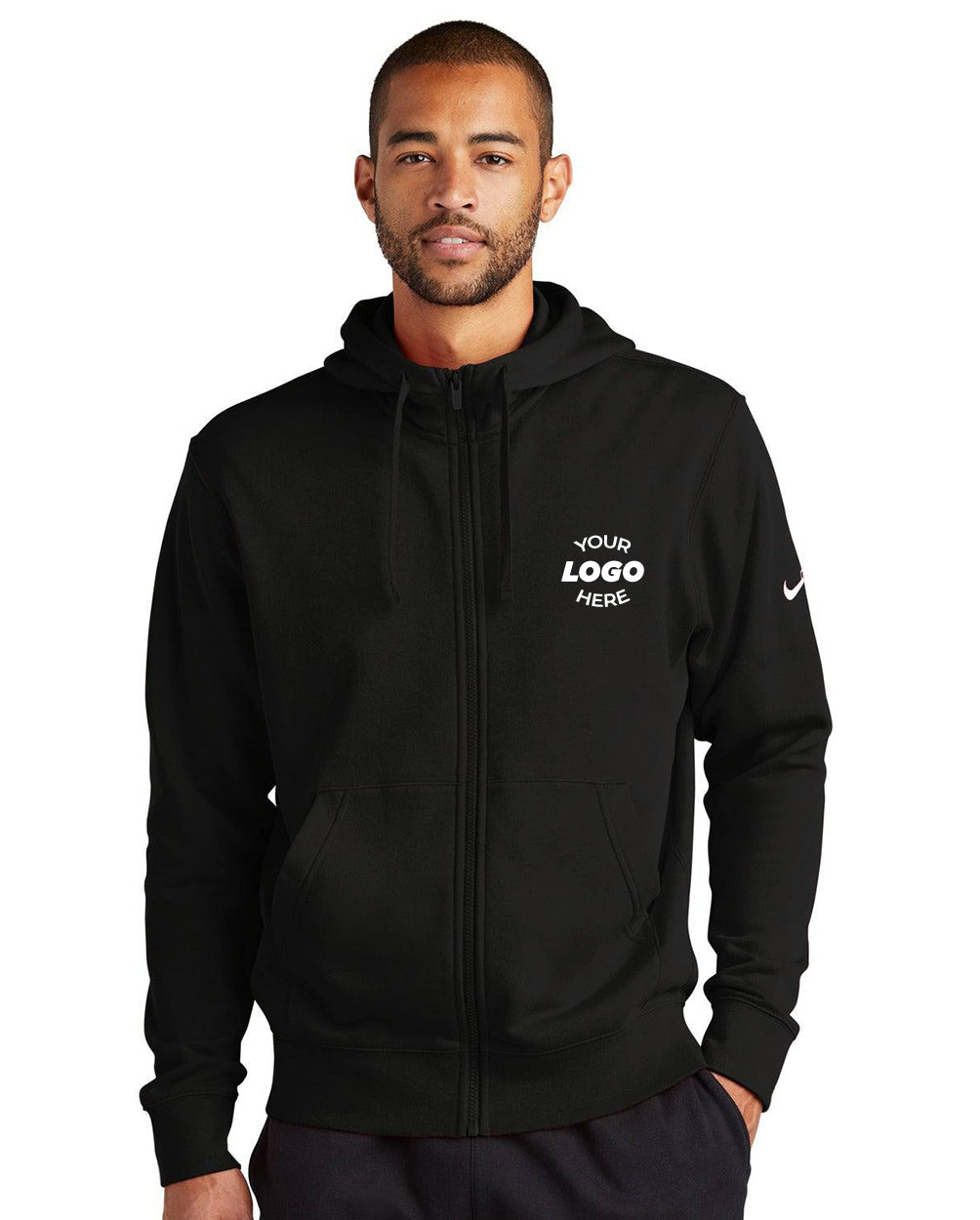 A man wearing a Nike Club Fleece Sleeve Swoosh Full-Zip Hoodie Sweatshirt NKDR1513 in black, featuring front pockets and "YOUR LOGO HERE" on the left chest—ideal for an active lifestyle.