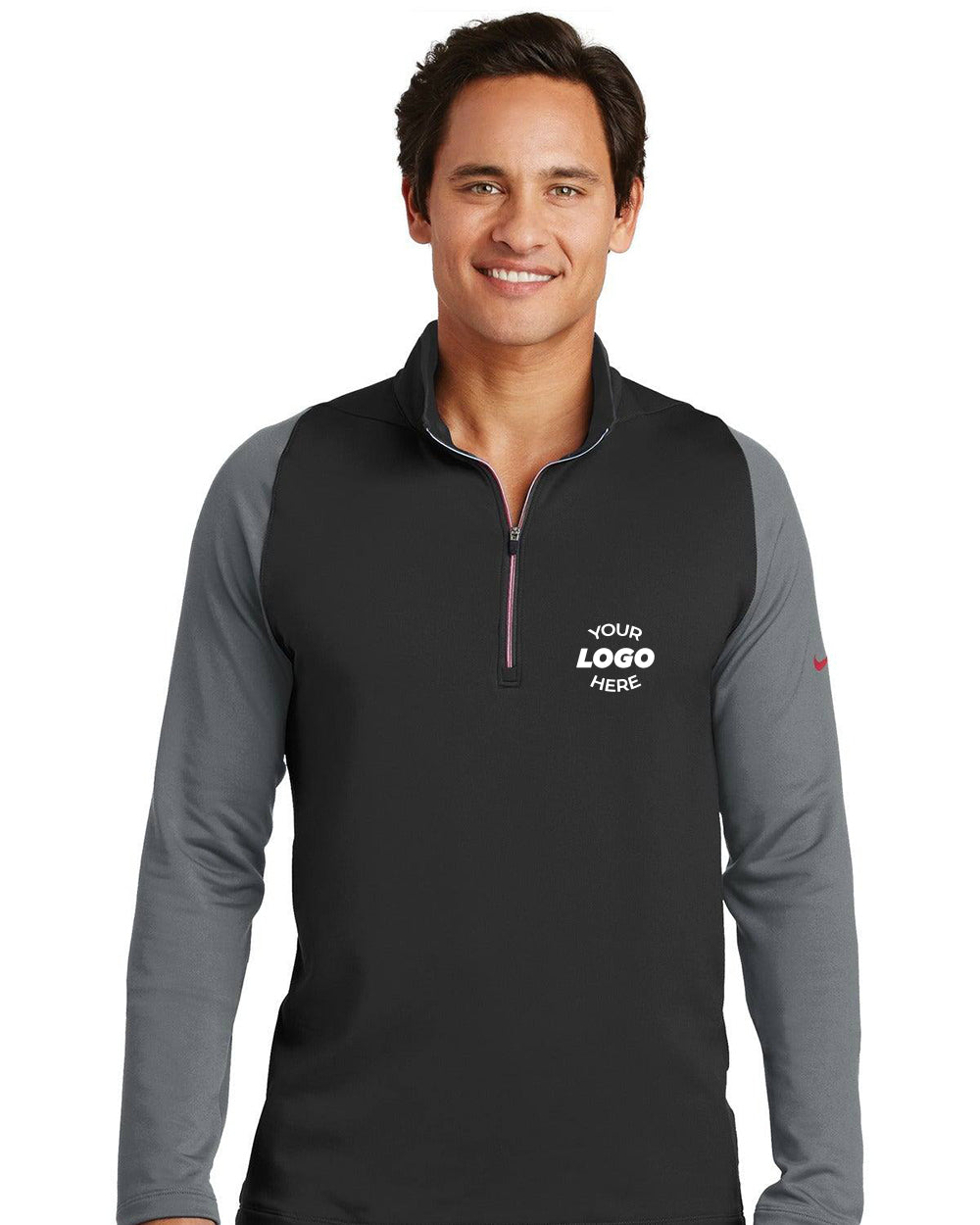 A man wearing a black and gray Nike Dri-FIT Stretch 1/2-Zip Pullover (style 779795) with "Your Logo Here" on the left chest stands and smiles at the camera.