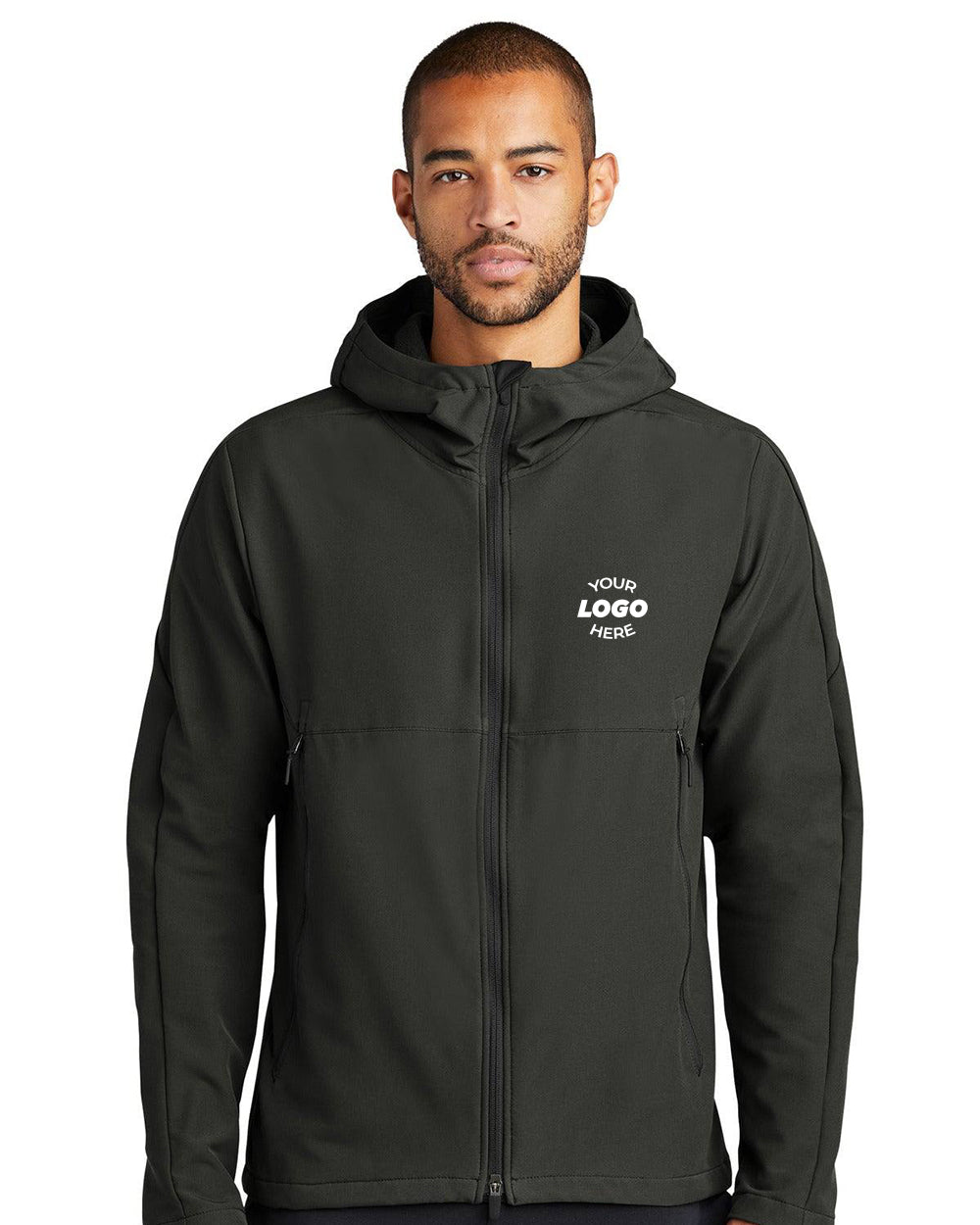 A man wearing a black Nike Hooded Soft Shell Jacket NKDR1543 with water-repellent stretch fabric and "YOUR LOGO HERE" text printed on the left chest.