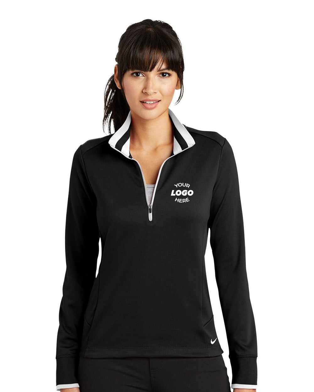 A person is wearing a sleek Nike Ladies Dri-FIT 1/2-Zip Pullover 578674 in black, emblazoned with "YOUR LOGO HERE" on the chest, against a plain white background.
