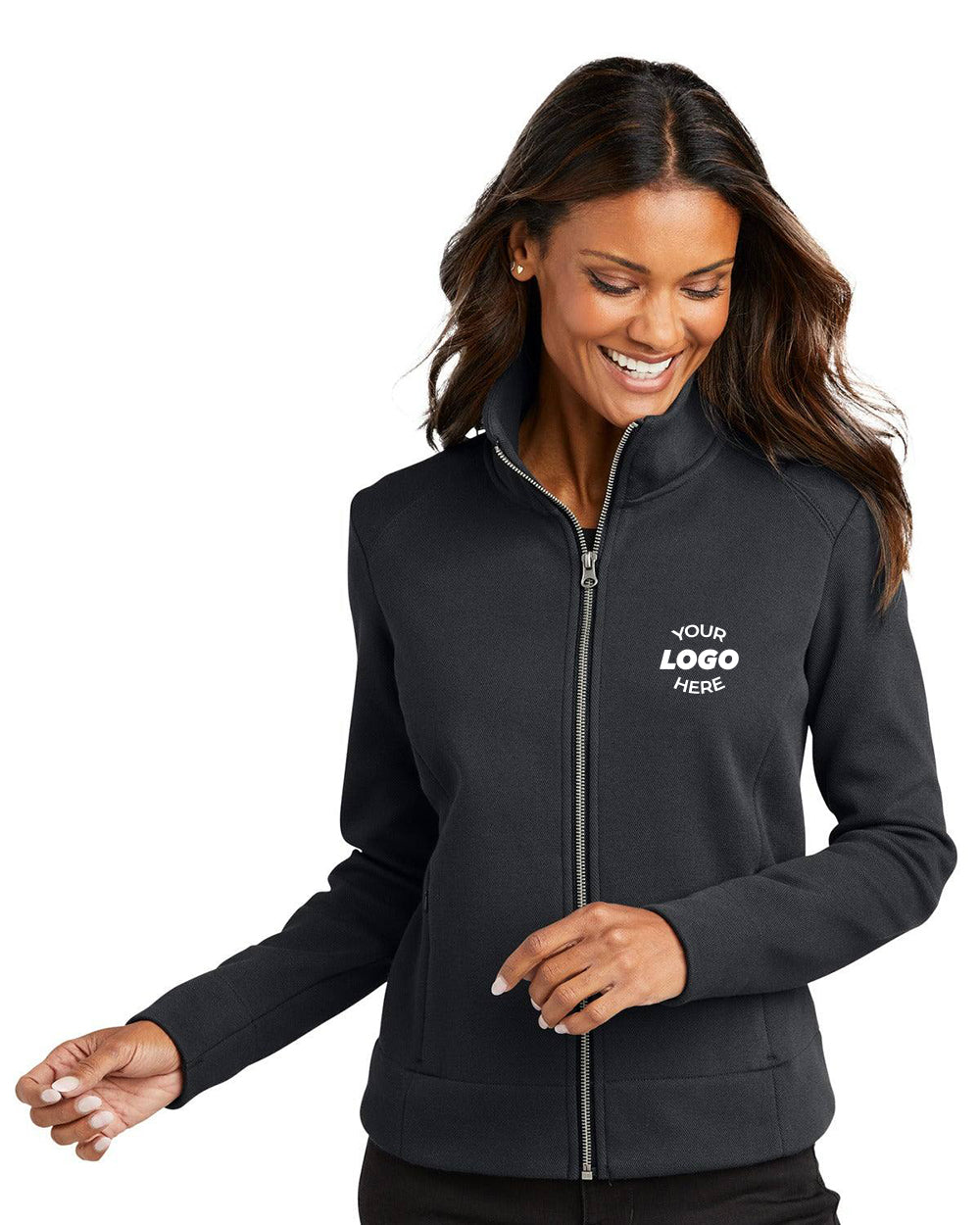 A woman smiles while looking down, wearing the Port Authority Ladies Network Fleece Jacket L422 with "Your Logo Here" on the left chest—a stylish branded layer from Port Authority, ideal for staying warm in cold weather.
