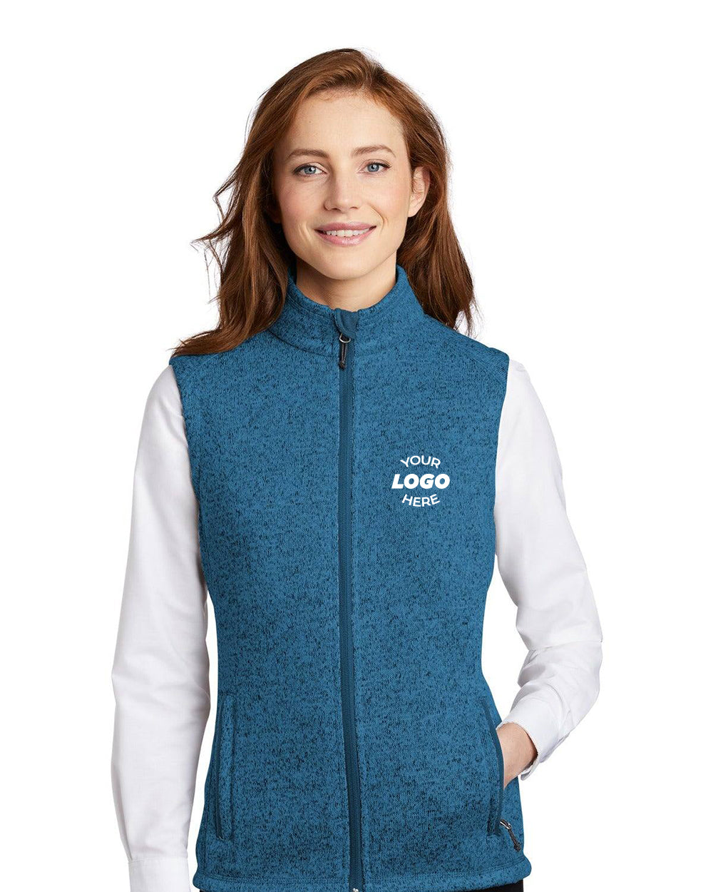 A woman wears the Port Authority Ladies Sweater Fleece Vest L236 over a white shirt, featuring "Your Logo Here" on the left chest—a customizable corporate apparel option from Port Authority for cold weather.