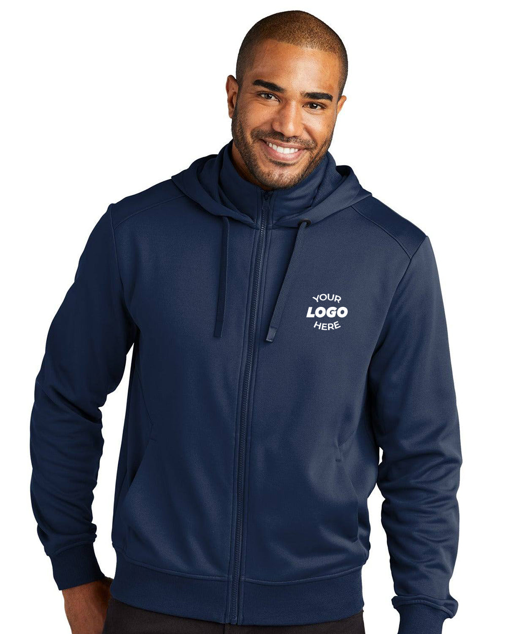 A man smiles while wearing the Port Authority Smooth Fleece Hooded Jacket F814, a navy blue zip-up hoodie from Port Authority with "YOUR LOGO HERE" printed on the left chest.