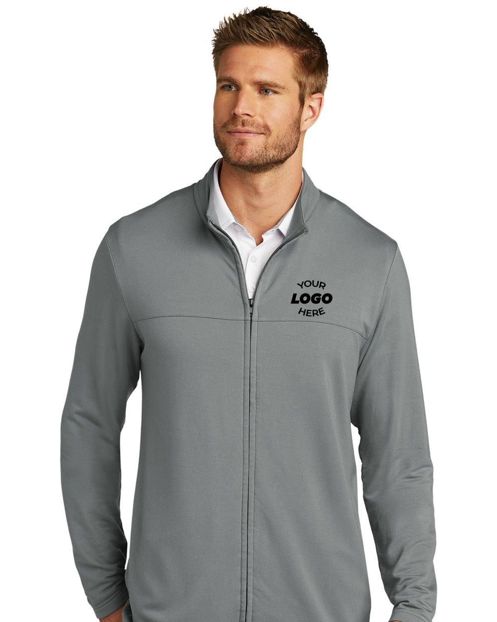 A man wearing a light gray TravisMathew Newport Full-Zip Fleece TM1MU420 with a white shirt underneath. "YOUR LOGO HERE" is displayed on the left chest of the TravisMathew jacket.