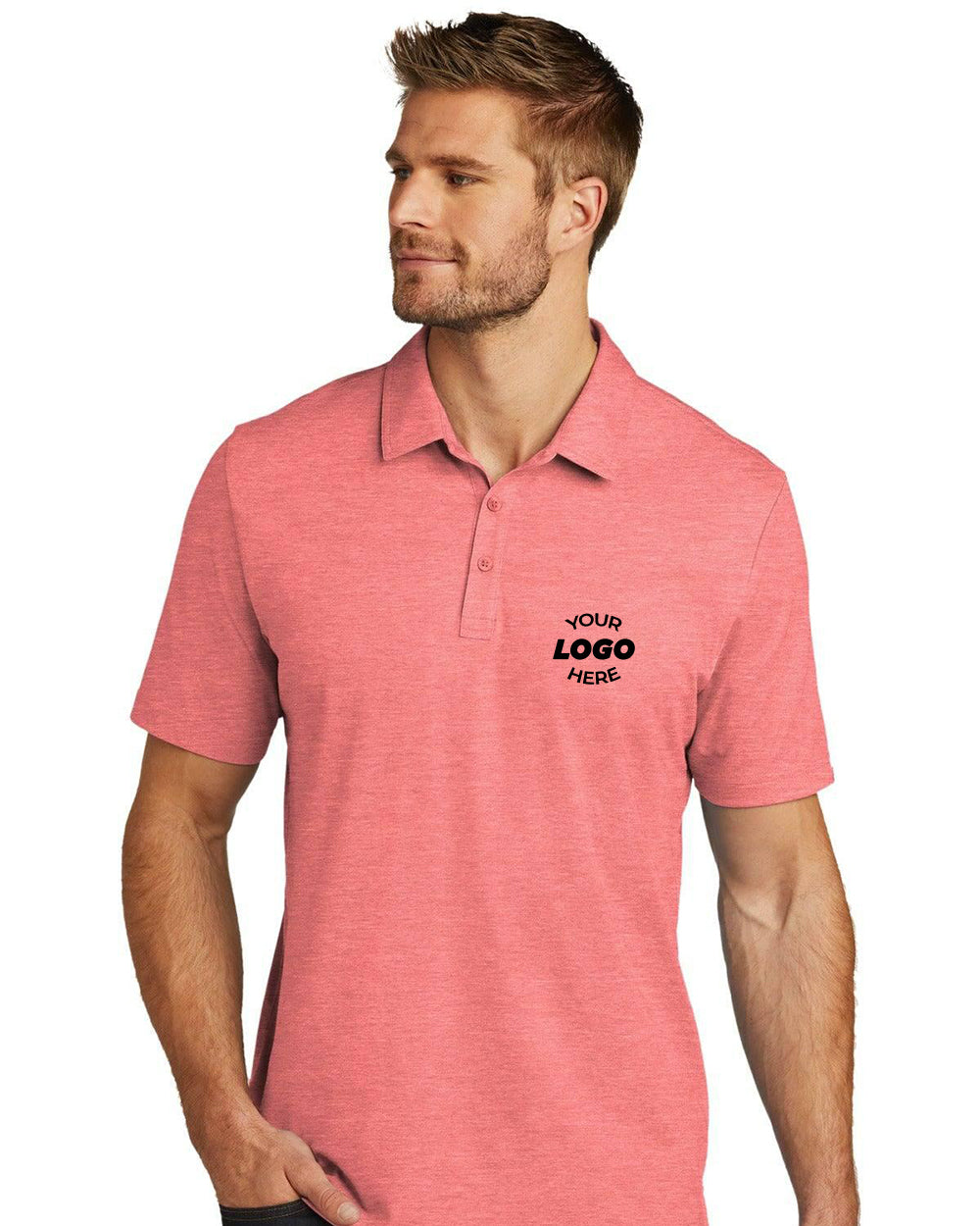 A man wears a pink TravisMathew Oceanside Heather Polo TM1MU412, featuring moisture-wicking fabric and "Your Logo Here" printed on the left chest, standing with one hand in his pocket.