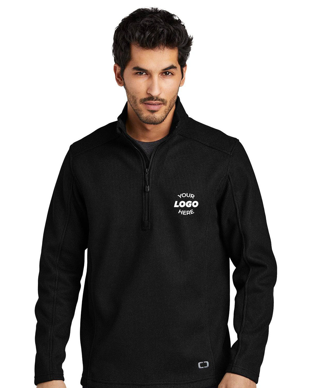 Man wearing an OGIO Grit Fleece 1/2-Zip Pullover (OG729) in black, featuring "Your Logo Here" on the left chest and a reverse coil zipper, standing against a white background.