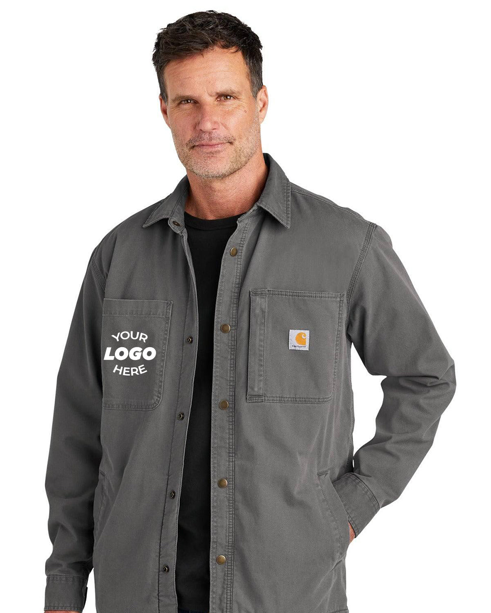 A man wearing the Carhartt Rugged Flex Fleece-Lined Shirt Jacket CT105532, featuring a logo space and small chest label. The gray button-up design provides a fleece-lined interior for outdoor activities and incorporates Rugged Flex technology for added durability and comfort.