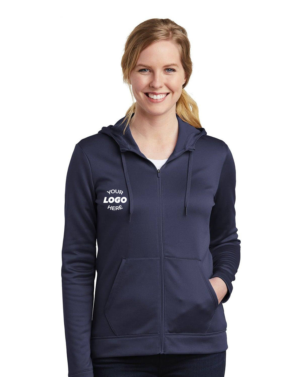 A person wearing the Nike Ladies Therma-FIT Full-Zip Fleece Hoodie Sweatshirt (NKAH6264) in navy blue with their hands in the pockets. The Nike hoodie features Therma-FIT fabric for warmth and a distinctive logo on the left chest, providing a snug yet feminine fit.