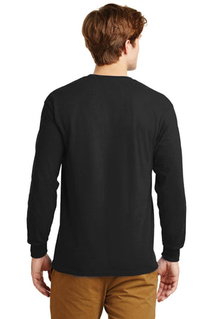 A person faces away in a long-sleeve black Gildan 2400 shirt—100% US Cotton, custom screen-printed logo included (Pack of 36)—and tan pants, arms relaxed at their sides against a plain white background.