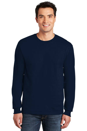 A man faces forward in blue jeans and a Gildan 100% US Cotton Long Sleeve T-Shirt (Pack of 36, style 2400) with a custom screen printed logo, standing against a white background.