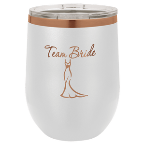 Experience a touch of elegance with our NEW Kodiak Coolers ION Plated Tumbler, featuring custom engraving in "Ghost Black & Rose Gold," and adorned with the text "Team Bride" above an illustration of a gown. This beautifully crafted mug is the perfect personalized gift for weddings or bachelorette parties.