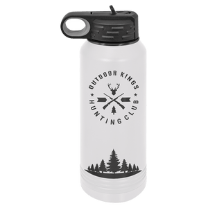 White water bottle from Kodiak Coolers featuring the "Outdoor Kings Hunting Club" logo with crossed arrows, a deer head, and trees. This NEW ION Plated Tumbler is custom engraved in "Ghost Black & Rose Gold" for an elegant promotional gift. The base displays a silhouette of pine trees, making it perfect for adventurers who value both design and functionality in their gear.
