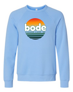 Light blue unisex "Bode Summer Bootcamp - OG Logo" crewneck sweatshirt by designerapp, featuring a retro sunset graphic and "bode SUMMER CAMP '26" on the front. Made from pre-shrunk Airlume cotton for comfort.