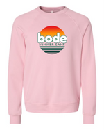 The designerapp Bode Summer Bootcamp "OG Logo" Unisex Crewneck BC Fleece Raglan Sweatshirt 3901 is a light pink, pre-shrunk top with a circular sunset graphic and text, made from soft Airlume combed and ring-spun cotton.