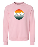 The designerapp Bode Summer Bootcamp "OG Logo" Unisex Crewneck BC Fleece Raglan Sweatshirt 3901 features a light pink color, retro sunset graphic, and "bode SUMMER CAMP '26" text on soft Airlume combed and ring-spun cotton.