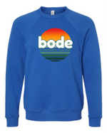 The designerapp Bode Summer Bootcamp "OG Logo" unisex crewneck BC Fleece Raglan Sweatshirt 3901 features a retro sunset graphic and text on ultra-soft Airlume cotton for comfort.