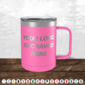 A pink insulated mug with a handle, featuring "TODAY ONLY - Custom Logo Drinkware Sale - Your Logo Laser Engraved INCLUDED in Price - No Hidden Fee's" text, displayed on a wooden surface against a muted forest backdrop.