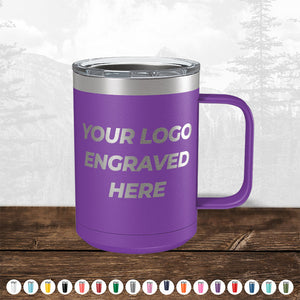 A purple insulated mug with a handle, featuring a custom printed area labeled "TODAY ONLY - Hump Day Sale - Your Logo Engraved on Drinkware - Single Side Engraving Included in Price - Slider Lids Included," displayed on a wooden surface with a faint forest background by Kodiak Coolers.