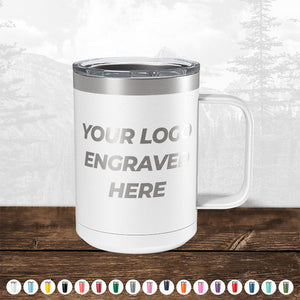 Customizable TODAY ONLY - Custom Logo Drinkware Sale - Your Logo Laser Engraved INCLUDED in Price - No Hidden Fee's stainless steel tumbler with a clear lid, displayed on a wooden surface, featuring placeholder text for engraving. Background shows a blurred forest scene. Ideal as a promotional gift from Kodiak Coolers.
