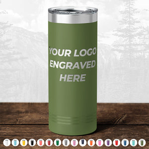 Green insulated tumbler (TODAY ONLY - Custom Logo Drinkware Sale - Your Logo Laser Engraved INCLUDED in Price - No Hidden Fee's) on a wooden surface with text "your logo engraved here" and a blurred forest background, ideal as a promotional gift from Kodiak Coolers.