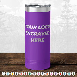 Purple insulated tumbler with "TODAY ONLY - Custom Logo Drinkware Sale - Your Logo Laser Engraved INCLUDED in Price - No Hidden Fee's" text, displayed on a wooden surface against a blurry forest background from Kodiak Coolers.