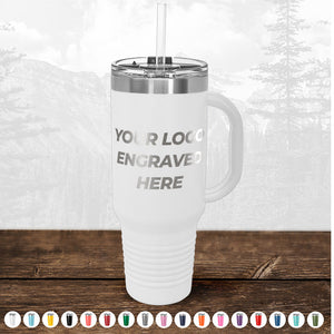 A customizable promotional gift TODAY ONLY - Custom Logo Drinkware Sale - Your Logo Laser Engraved INCLUDED in Price - No Hidden Fee's mug with a straw on a wooden surface, background showing faded trees, text on mug reads "your logo engraved here". By Kodiak Coolers.