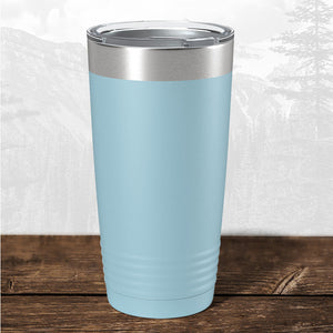 A Wisconsin Green Bay Bulldogs 20 oz tumbler from Kodiak Coolers, featuring a laser engraved design and stainless steel lid, sits on a wooden surface—ideal drinkware for school supporters and Bulldogs fans.