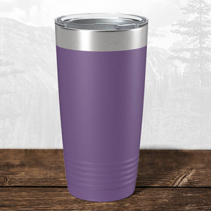 A Wisconsin Green Bay Bulldogs 20 oz tumbler by Kodiak Coolers with a laser-engraved school design and metal lid rests on wood—ideal drinkware for students and fans looking to show team pride.