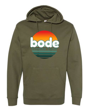 The Printify 2026 Bode Summer Bootcamp OG Logo Hoodie Sweatshirt (Unisex) features an olive green cotton-poly fleece, sunset chest graphic, adjustable hood, and is crafted from durable Independent Trading Co. SS4500 material.
