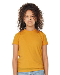 A young girl in a comfortable yellow BELLA + CANVAS Youth Triblend T-Shirt made of high-quality triblend material.