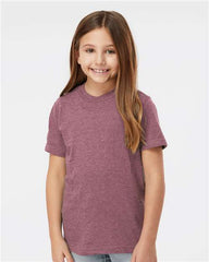 A young girl wearing a Tultex Youth Fine Jersey T-Shirt made with ringspun cotton fabric.