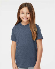 A young girl wearing a Tultex Youth Fine Jersey T-Shirt made with USA cotton for optimal comfort and durability.
