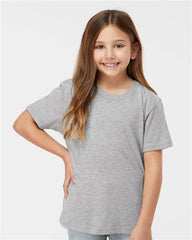 A young girl wearing a Tultex Youth Fine Jersey T-Shirt made from USA cotton, with double-needle stitching.