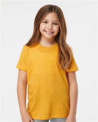 A young girl wearing a yellow Tultex Youth Fine Jersey T-Shirt 100% Cotton with double-needle stitching.
