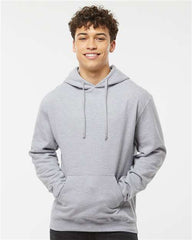 A man wearing a Tultex Unisex Fleece Hoodie Sweatshirt made of ringspun cotton/polyester fabric and jeans.