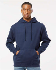 A man wearing a Tultex Unisex Fleece Hoodie Sweatshirt and jeans made of ringspun cotton/polyester.