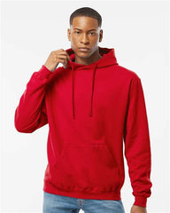 A man wearing a Tultex Unisex Fleece Hoodie Sweatshirt made of ringspun cotton/polyester and jeans.