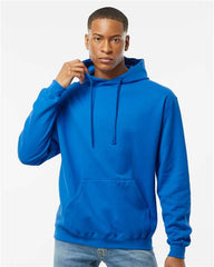 A man wearing a Tultex Unisex Fleece Hoodie Sweatshirt made of ringspun cotton/polyester blend and jeans.
