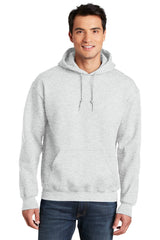 A man wearing a Gildan - DryBlend Pullover Hoodie Sweatshirt 12500.