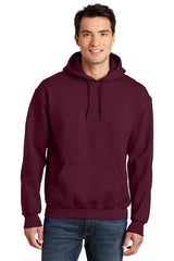 A man wearing a Gildan - DryBlend Pullover Hoodie Sweatshirt 12500 made with a comfortable cotton blend fabric.