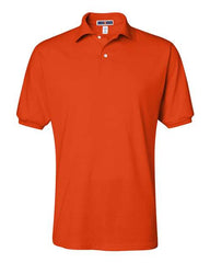 A plain, orange, short-sleeved JERZEES Jerzees Midweight Polo Cotton Poly Blend SpotShield 50/50 with a collar and buttons, displayed against a white background.
