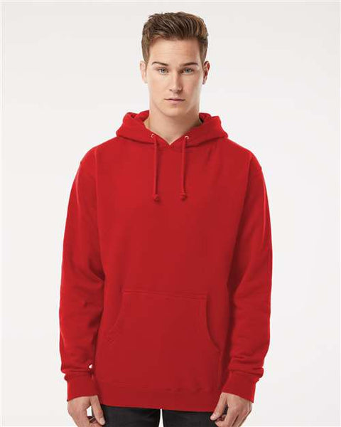 A young person wearing an Independent Trading Co. Heavyweight Hoodie Sweatshirt, crafted from a comfortable cotton/polyester blend, stands facing forward against a plain white background.