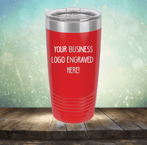 Red insulated tumbler, Kodiak Coolers Custom Logo 20 oz Tumblers - SPECIAL OFFER - Front side Logo Included, displayed on a wooden surface with a bokeh background.